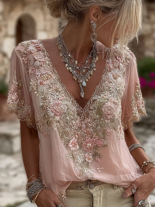 Blusa femenina con flores bordadas y elegante escote en V
