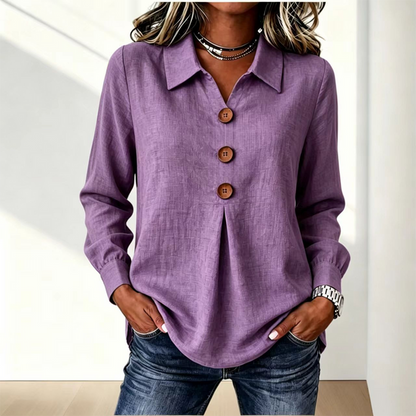 Blusa de mujer con cuello clásico y botones decorativos