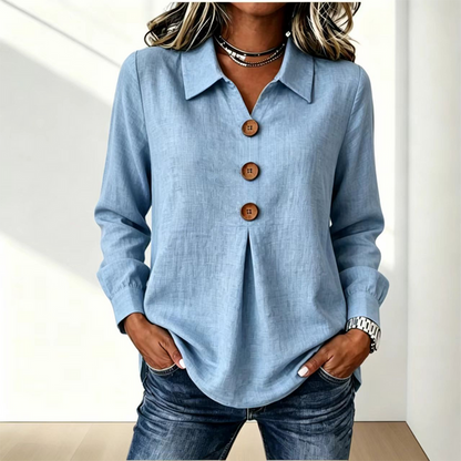 Blusa de mujer con cuello clásico y botones decorativos