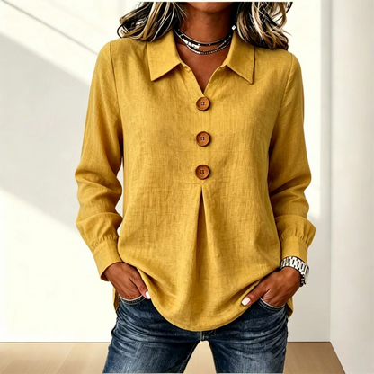 Blusa de mujer con cuello clásico y botones decorativos