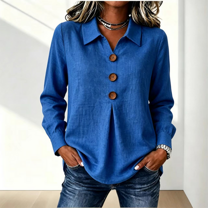 Blusa de mujer con cuello clásico y botones decorativos