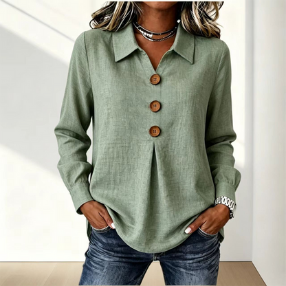 Blusa de mujer con cuello clásico y botones decorativos